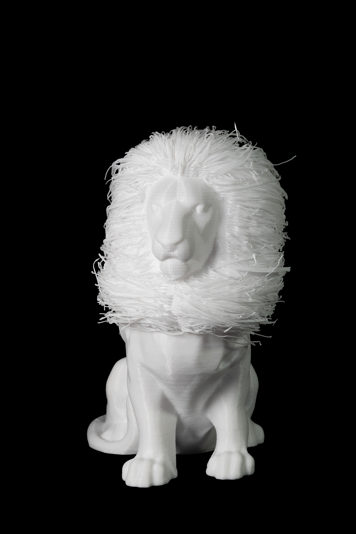 Photographie d'une figurine représentant un lion de face