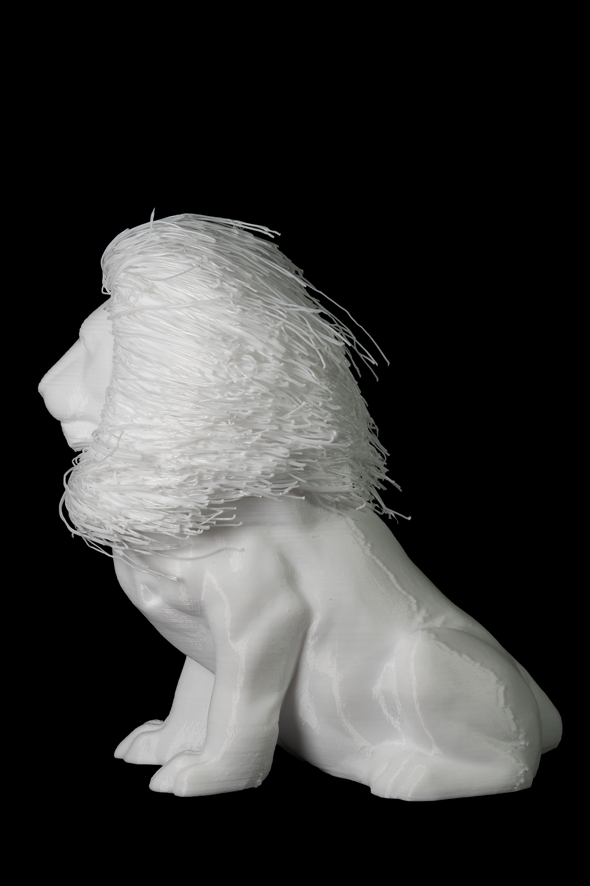 Photographie d'une figurine représentant un lion de profil gauche