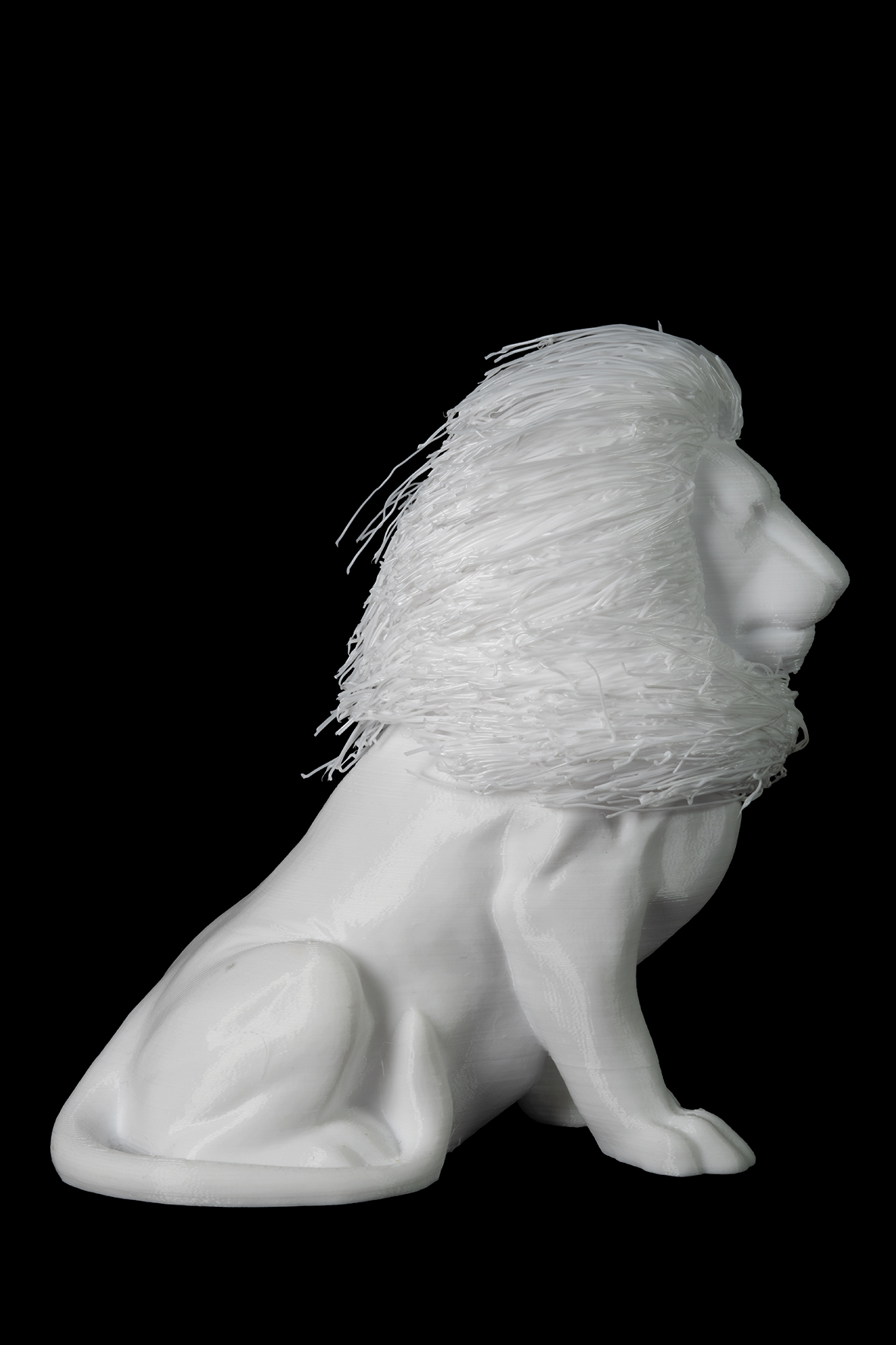 Photographie d'une figurine représentant un lion de profil droit